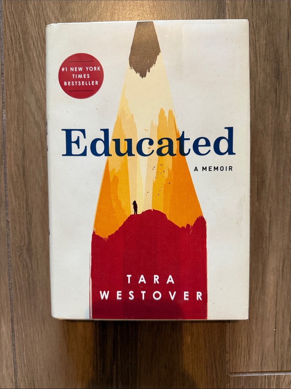 Educated by Tara Westover - Hardcover Memoir with Red and Yellow Cover